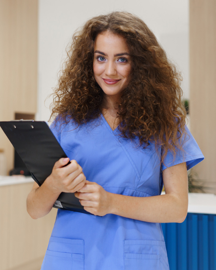 portrait of dentist nurse posing at reception on D7Q5QZY1